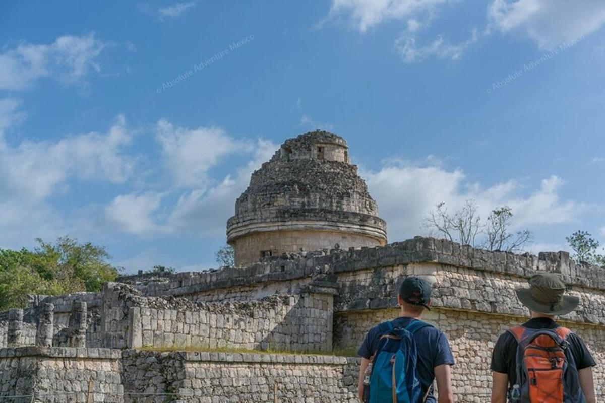 two people standing in front of a temple