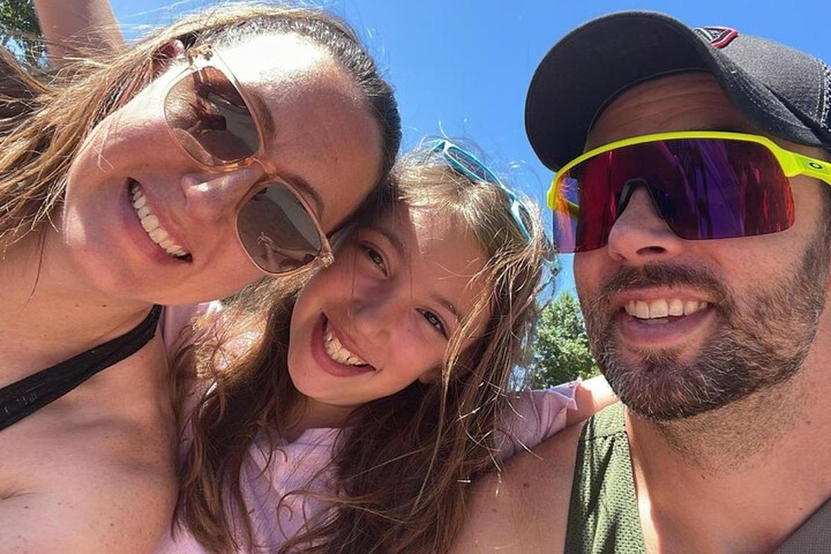 a group of three people posing for a picture