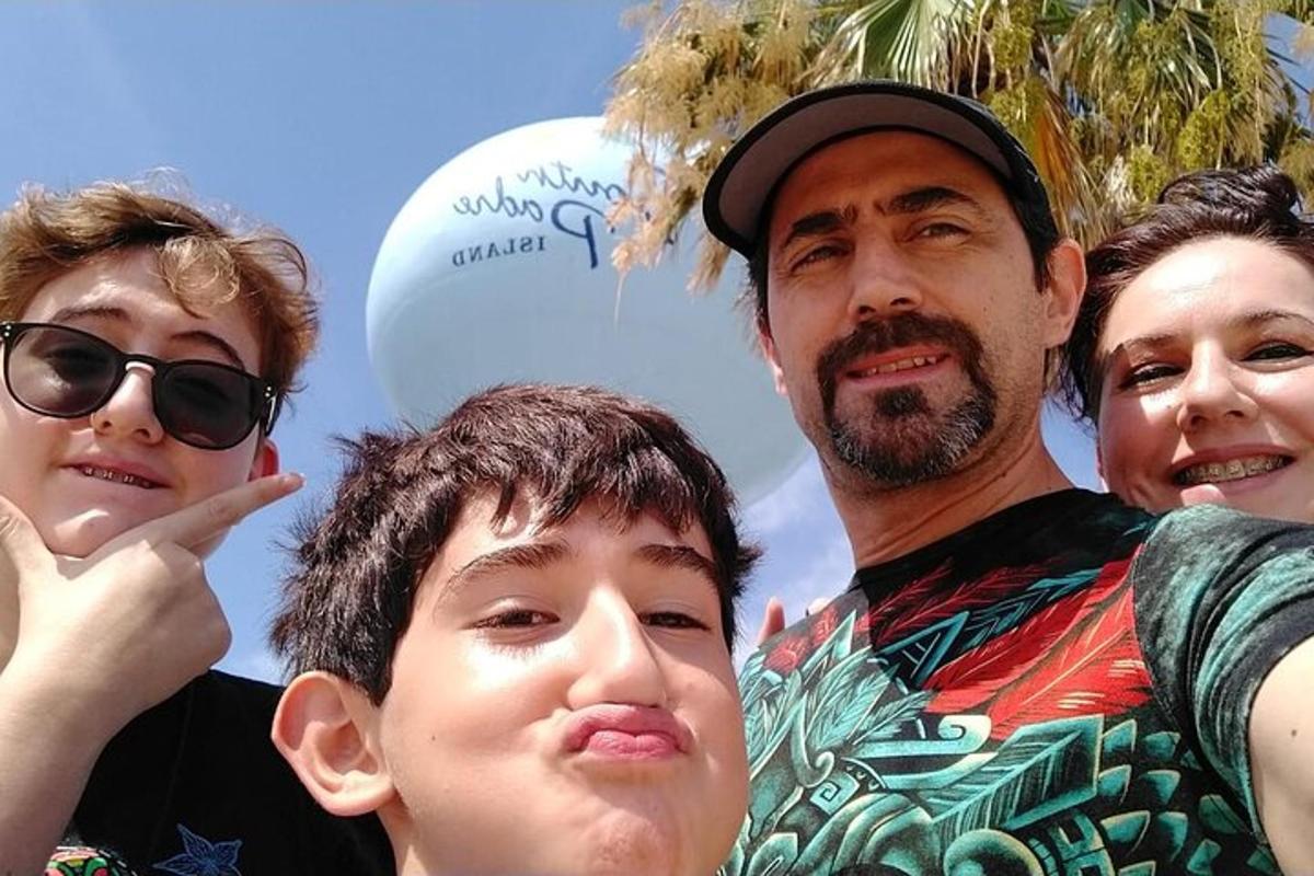 a man and two children posing for a picture