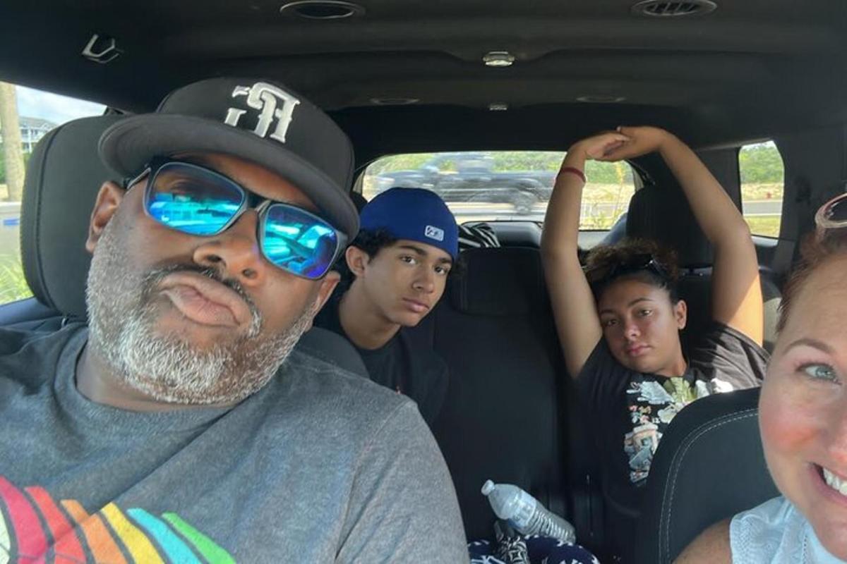 a group of people sitting in a car