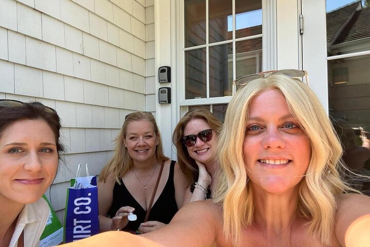 a group of women standing on a house