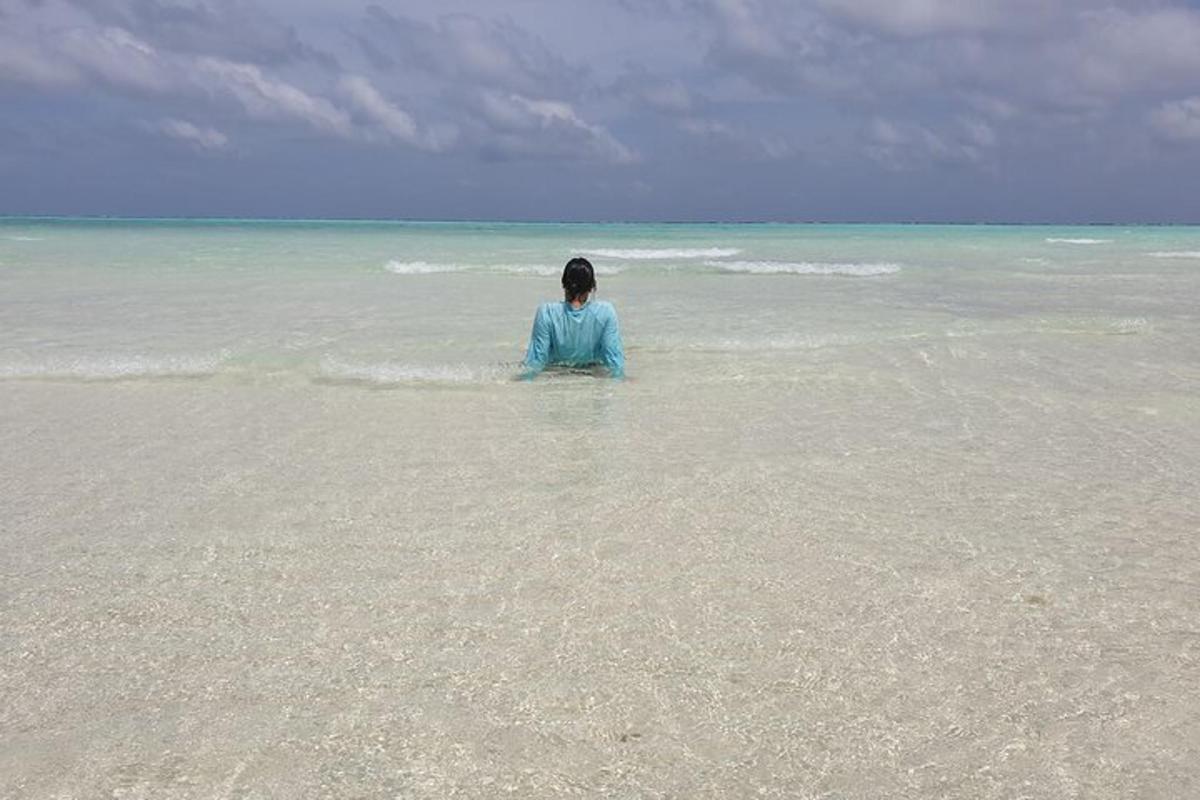 a person standing in the water in the ocean