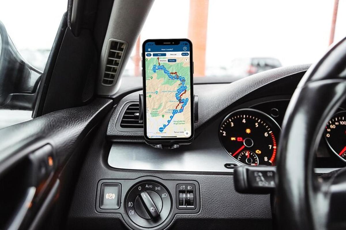 a cell phone sitting on the dashboard of a car