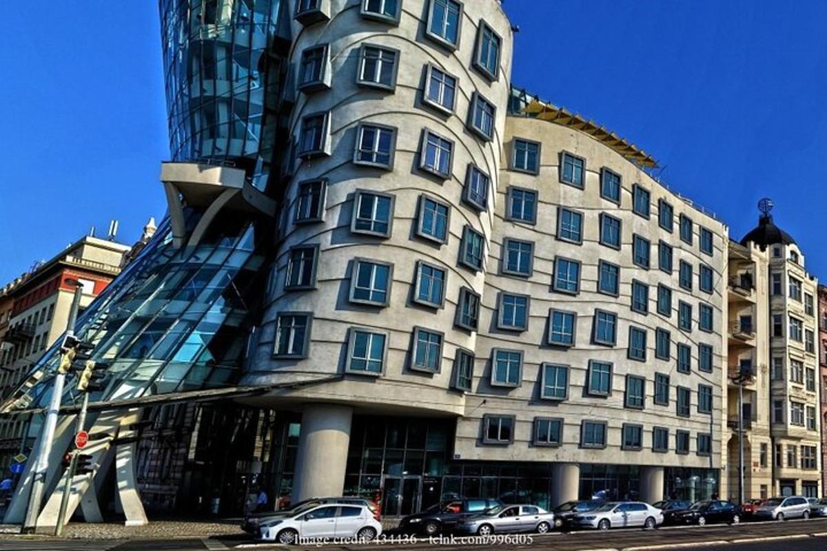 a large building with cars parked in front of it