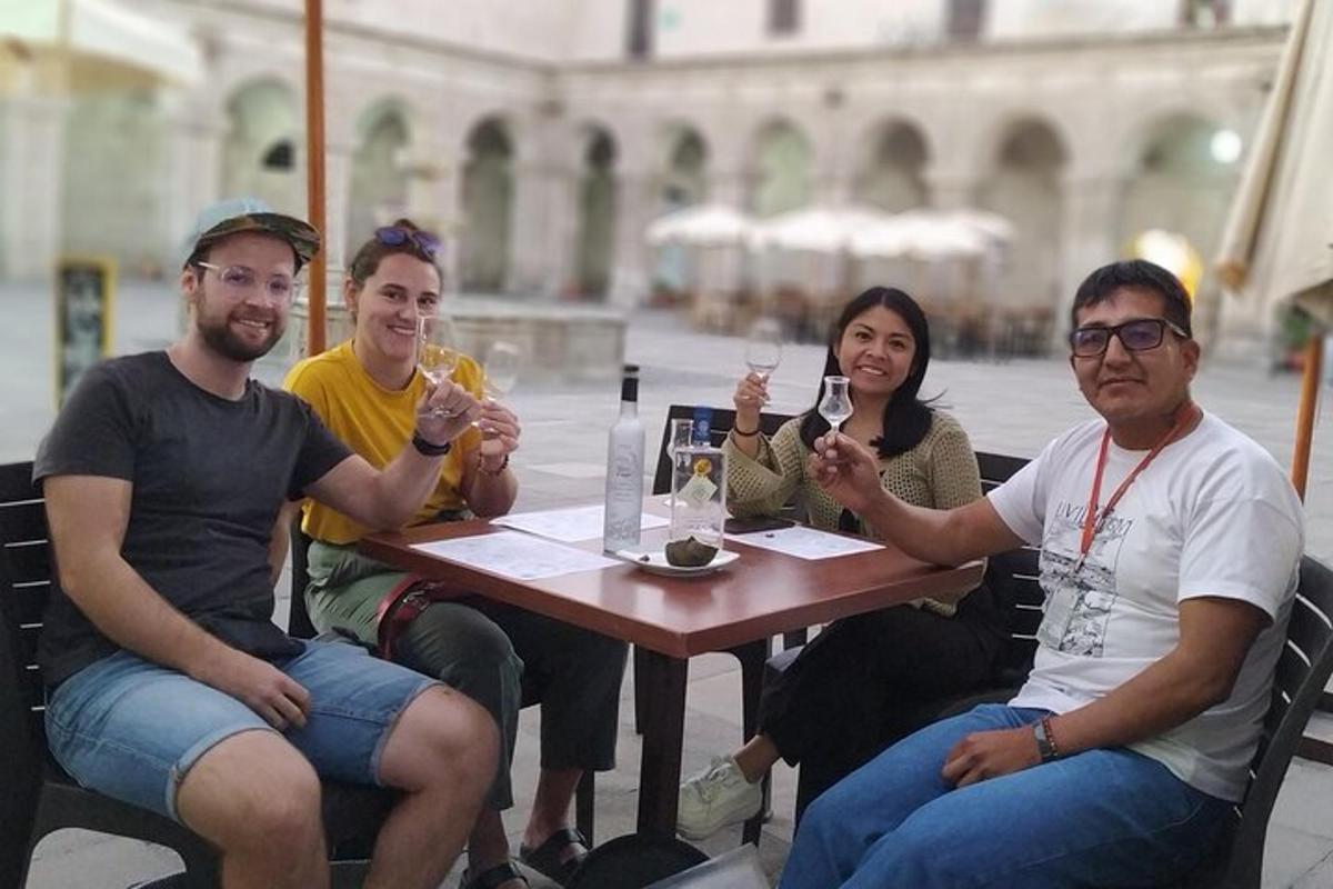 a group of people sitting around a table with wine glasses