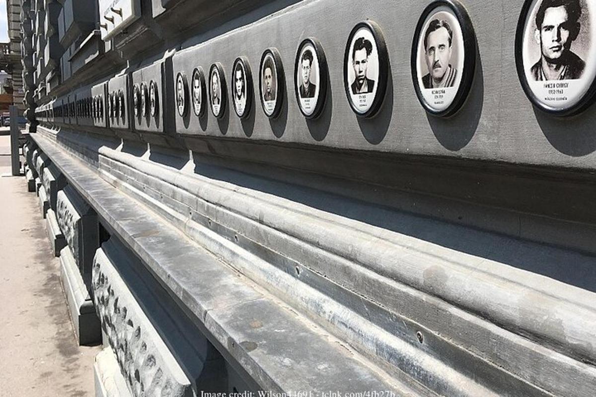 a row of benches with pictures of people on them