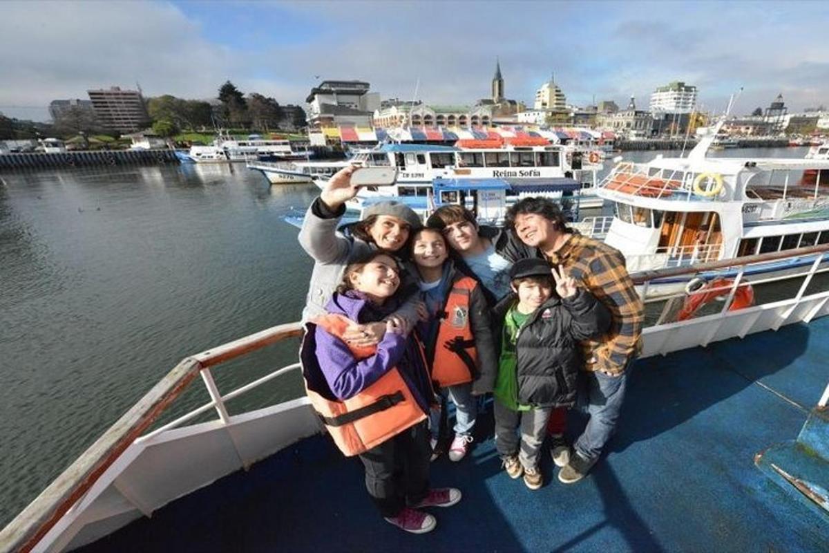 a group of people posing for a picture on a boat
