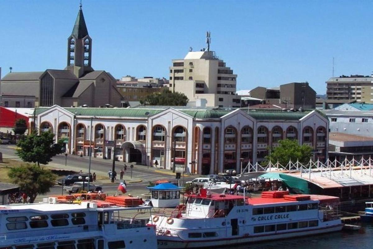 a large building with boats docked in a harbor