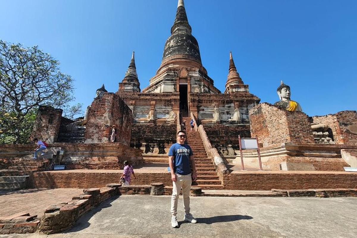 a man standing in front of a building