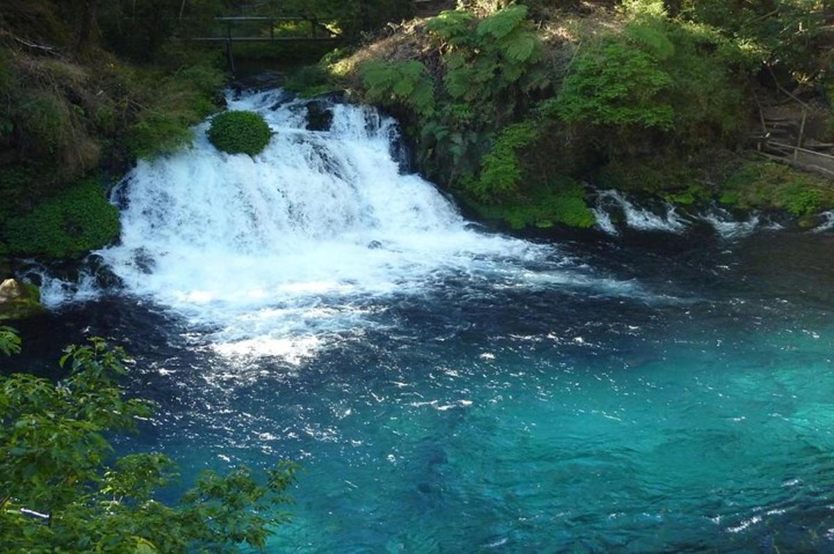 a waterfall in the middle of a river