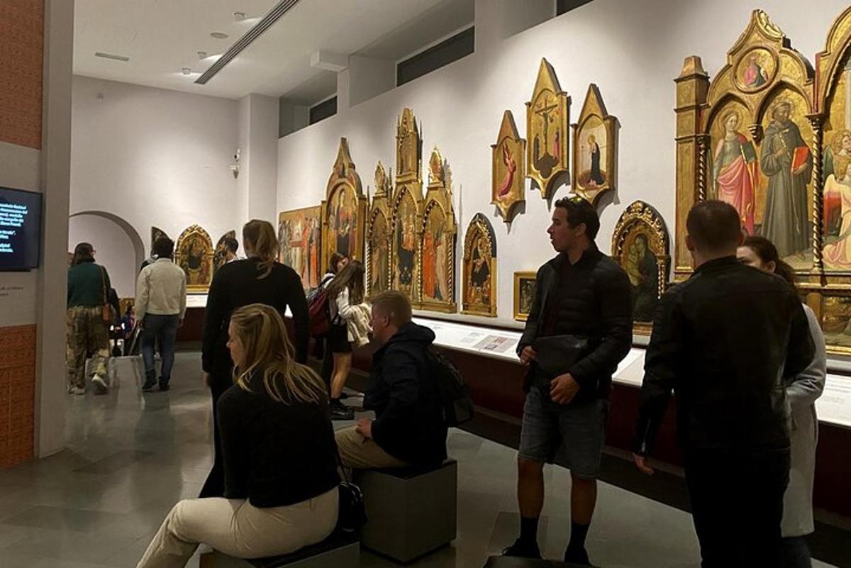 a group of people looking at art in a museum