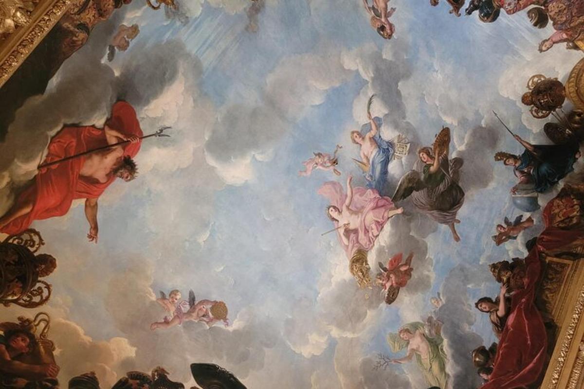 a ceiling with a painting of angels and demons
