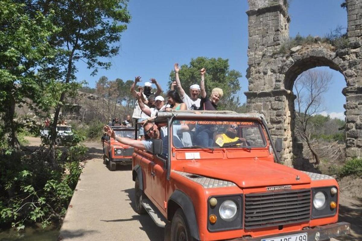 a group of people riding in the back of a truck