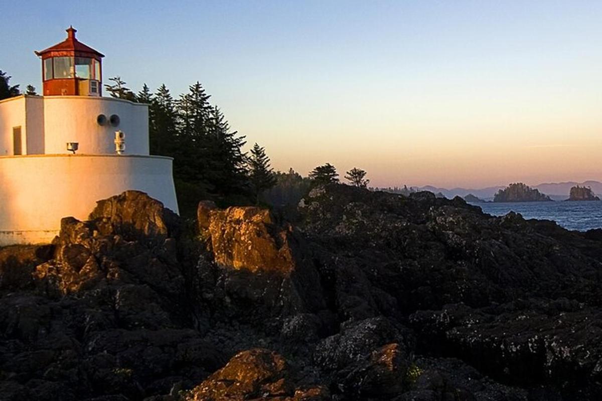 a lighthouse on the shore of a body of water