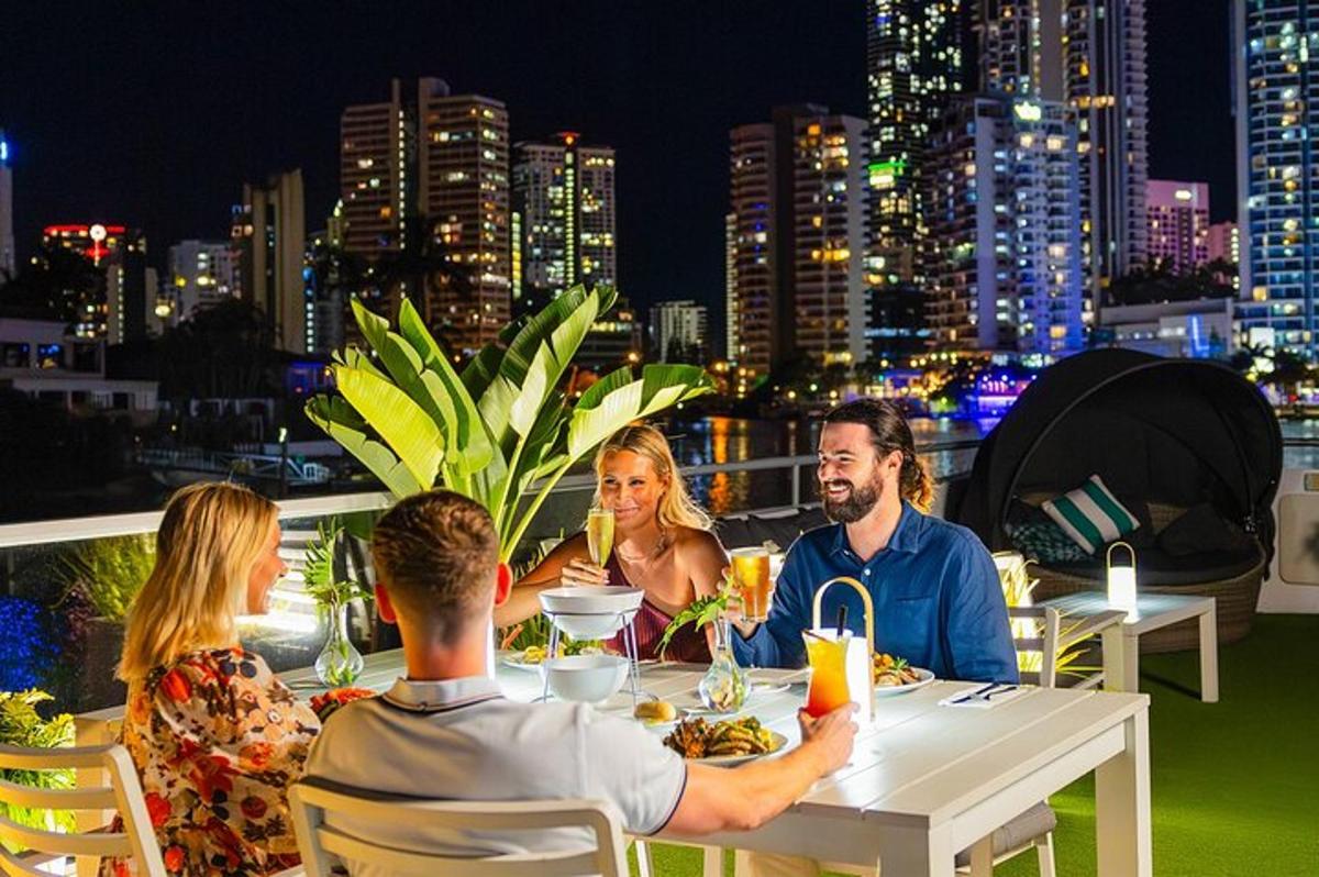 a group of people sitting at a table on a rooftop