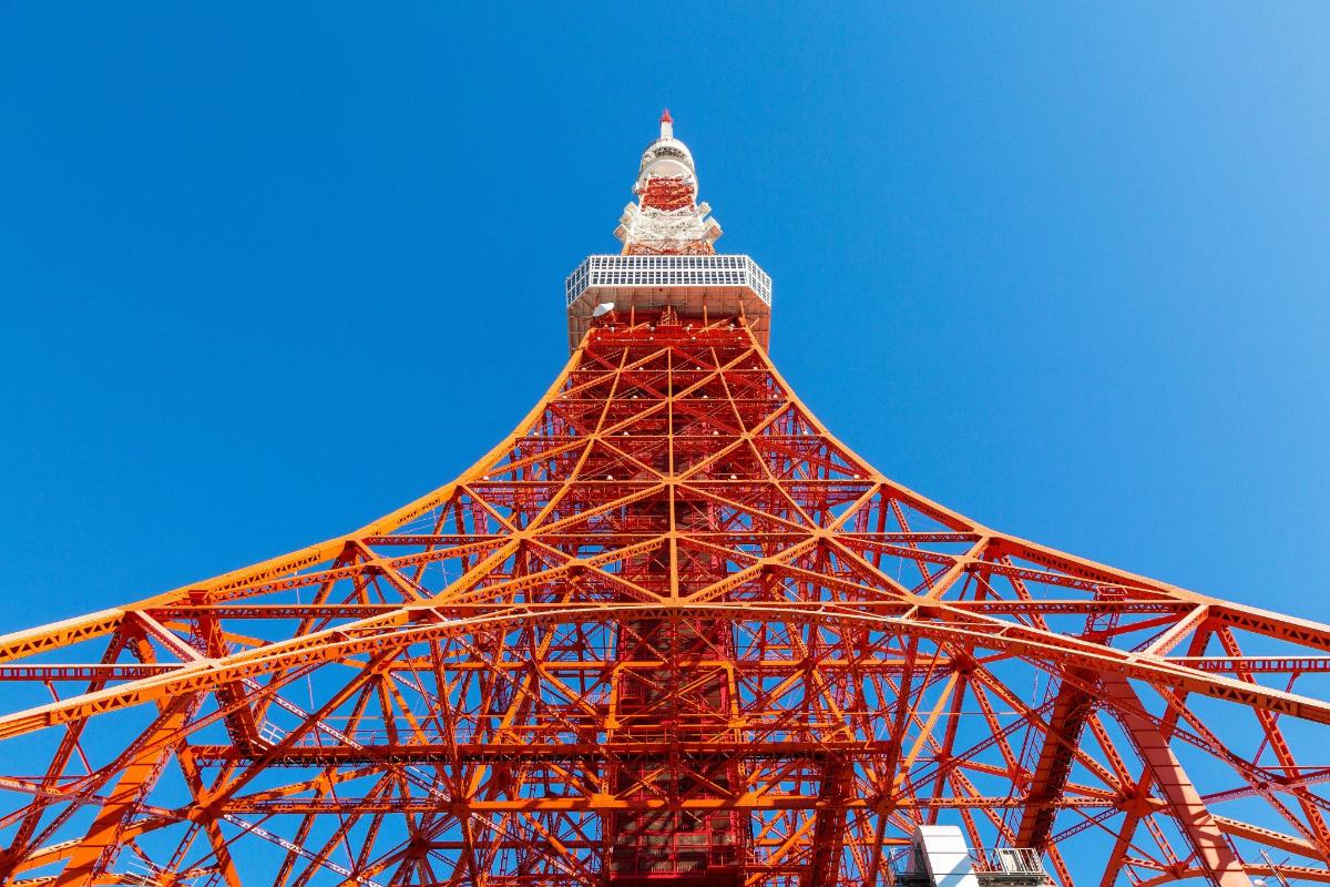 a view of the eiffel tower against a blue sky
