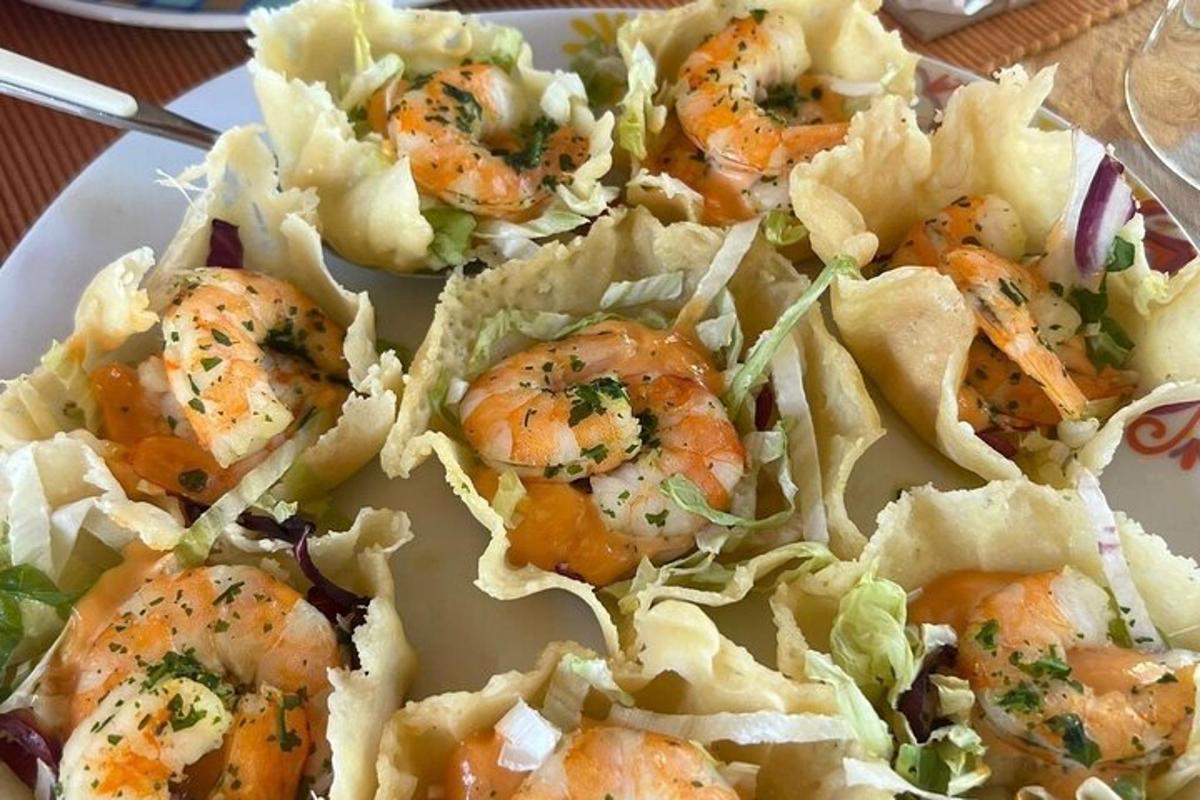 a plate of food with shrimp and lettuce