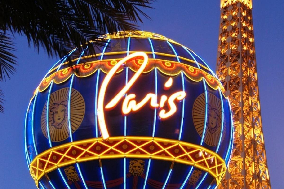 a sign that says pinks in front of a tower