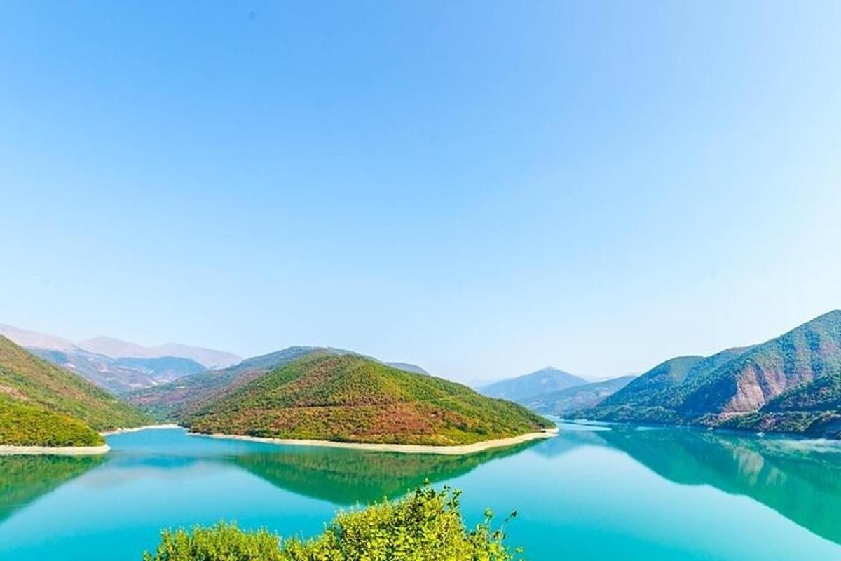 a view of a lake with mountains in the background