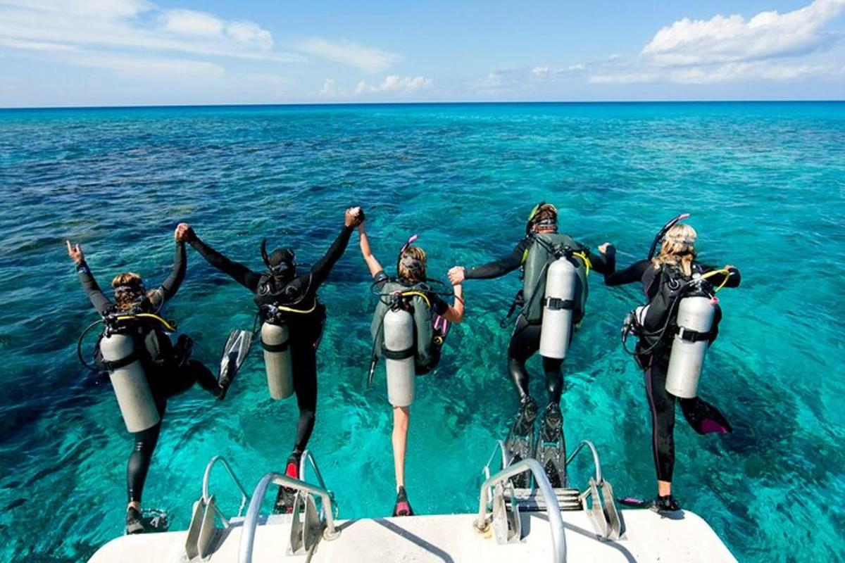 a group of people in the water on a boat
