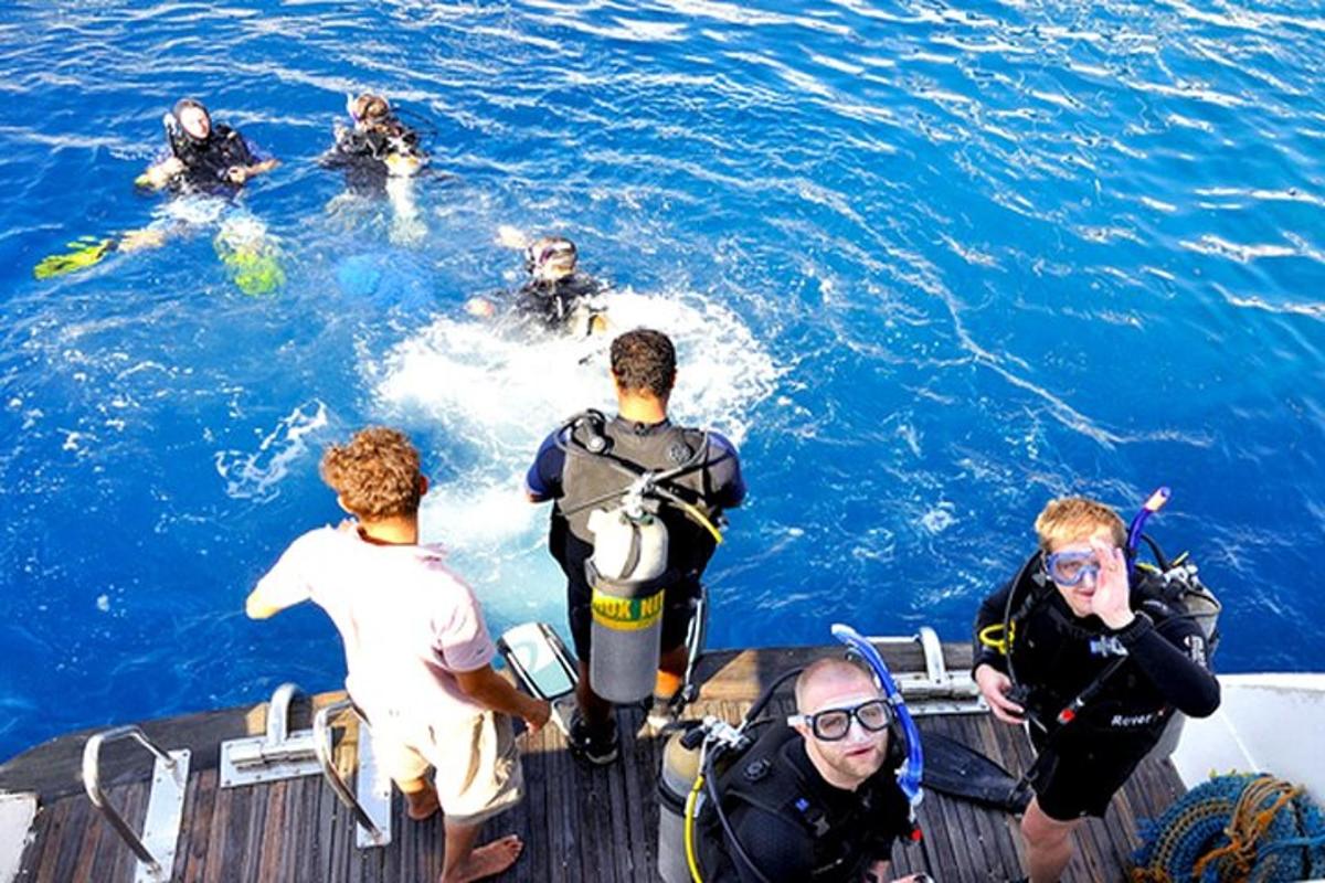 a group of people on a boat in the water