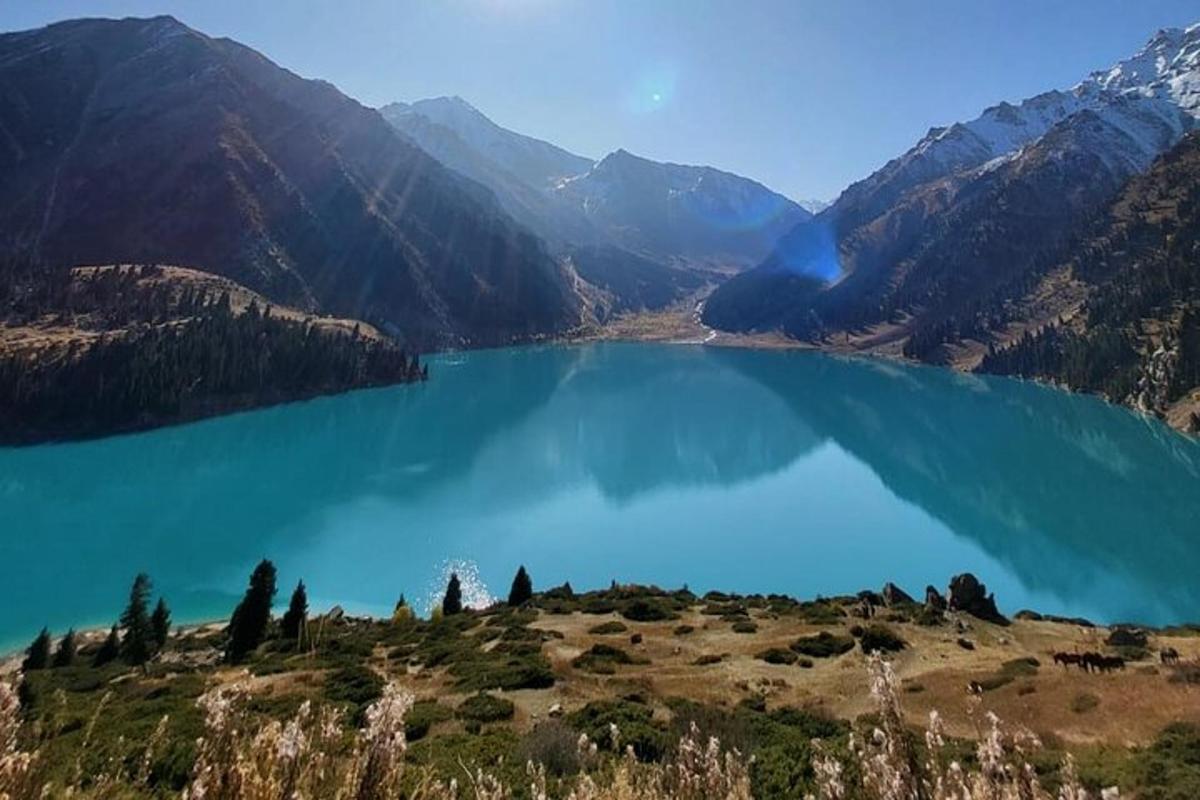 a view of a blue lake in the mountains