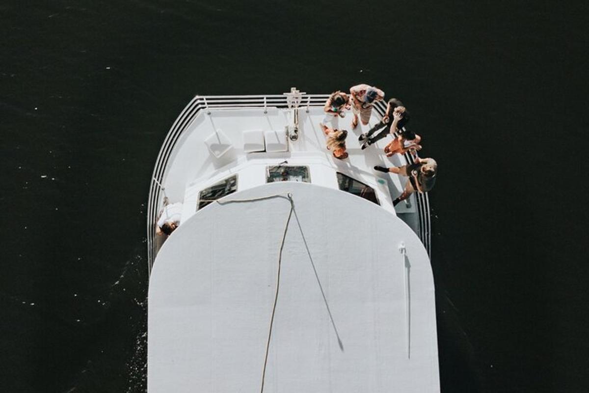 a group of people on a boat in the water