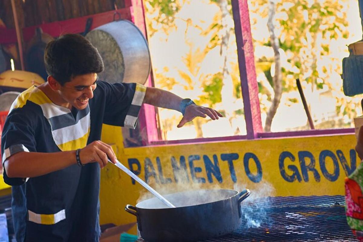 a man cooking in a pot on a table