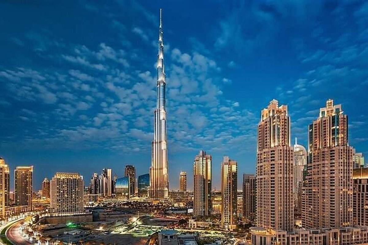 a view of a large city with a tall skyscraper