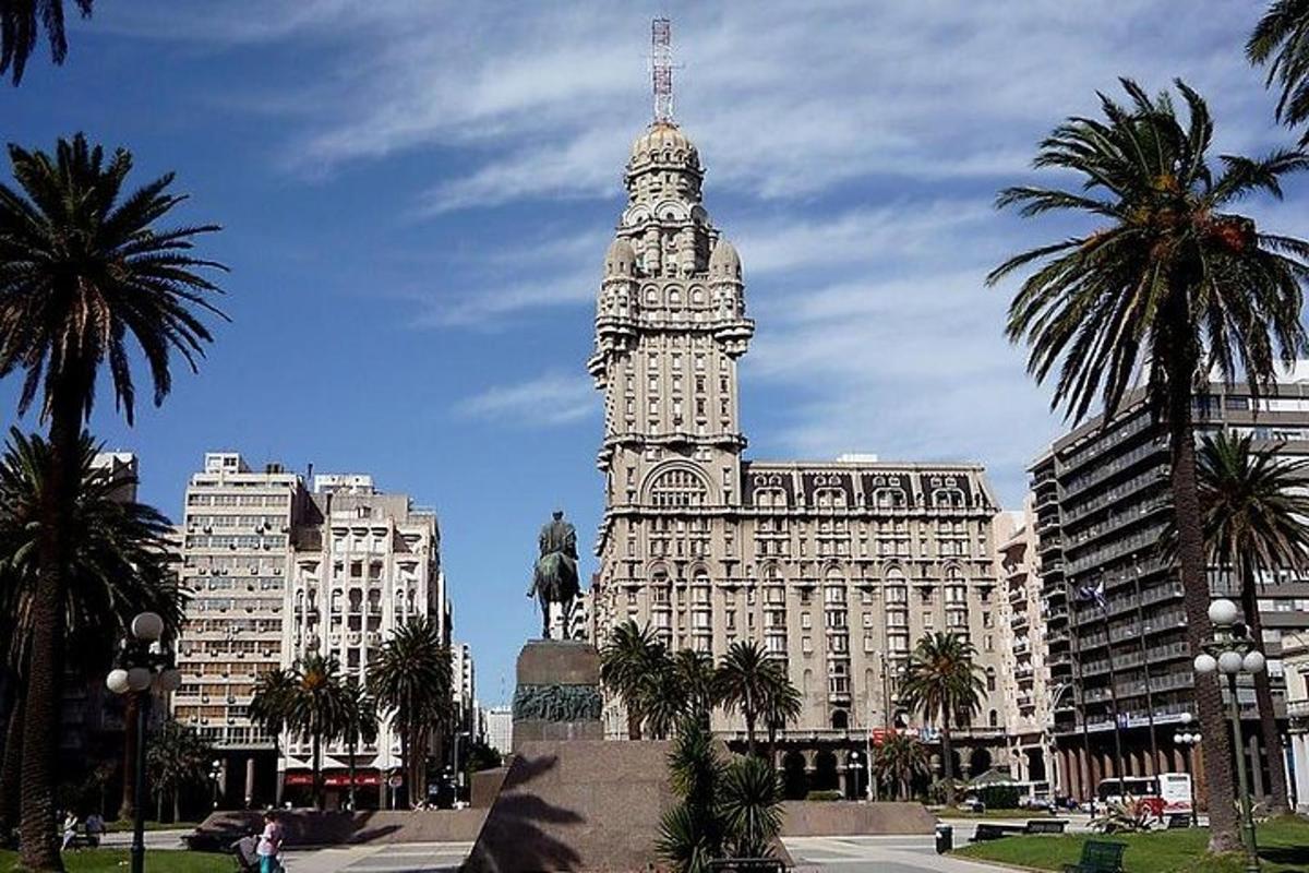 a tall building with a clock tower in a city