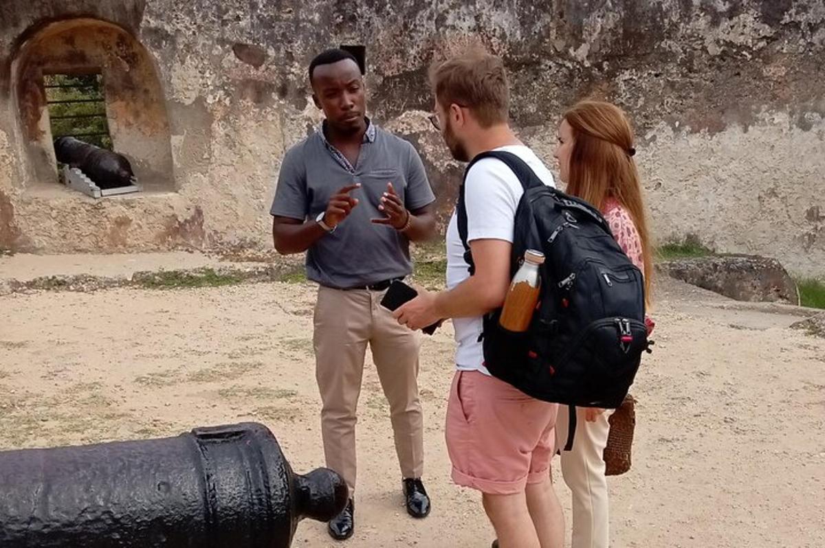 a group of three people standing next to a fire hydrant