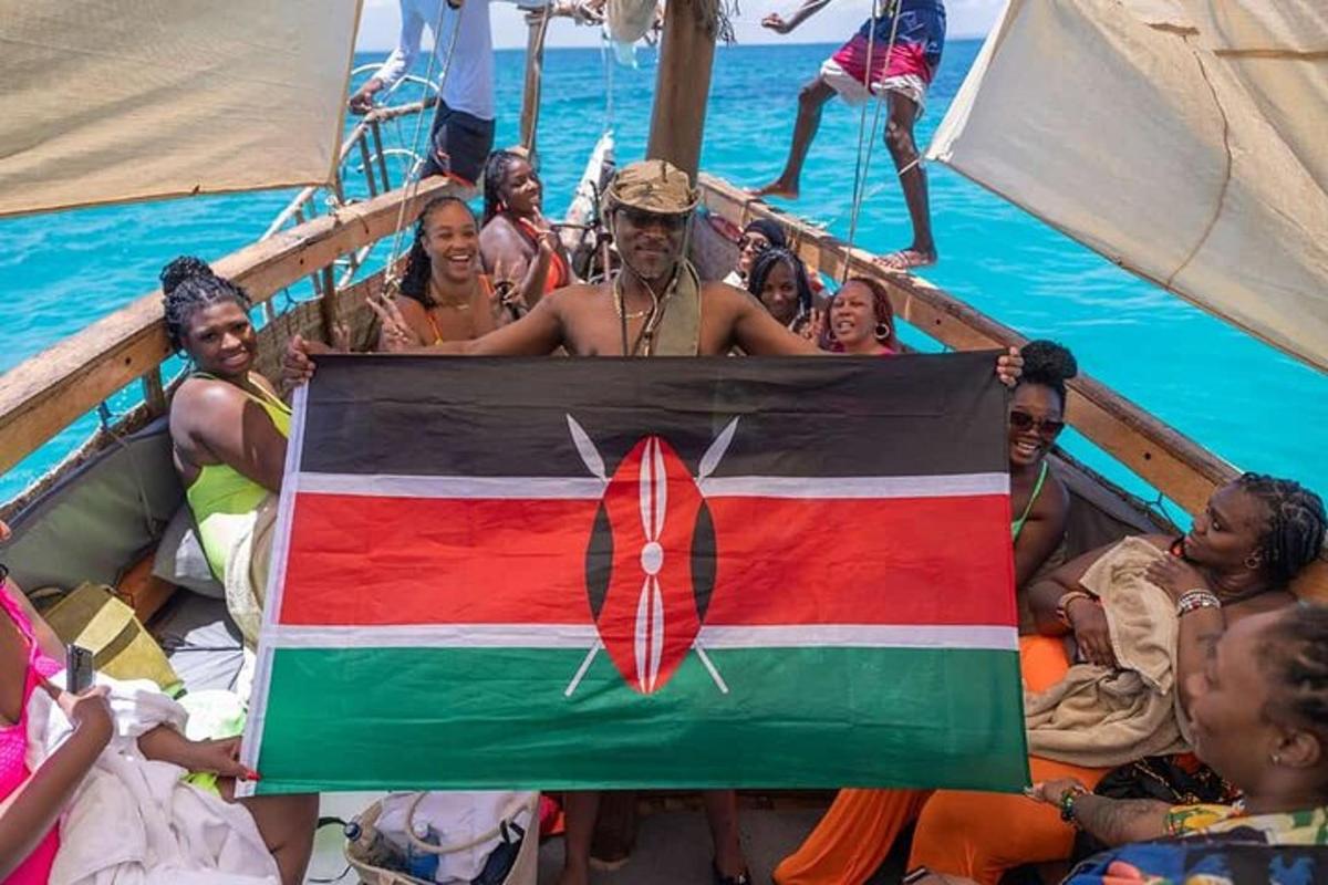 a group of people on a boat holding a flag