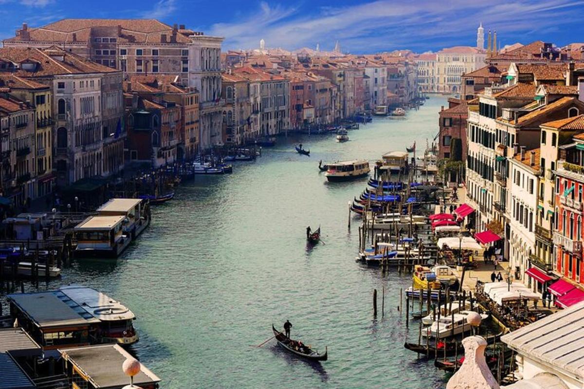 a view of a river with boats in a city