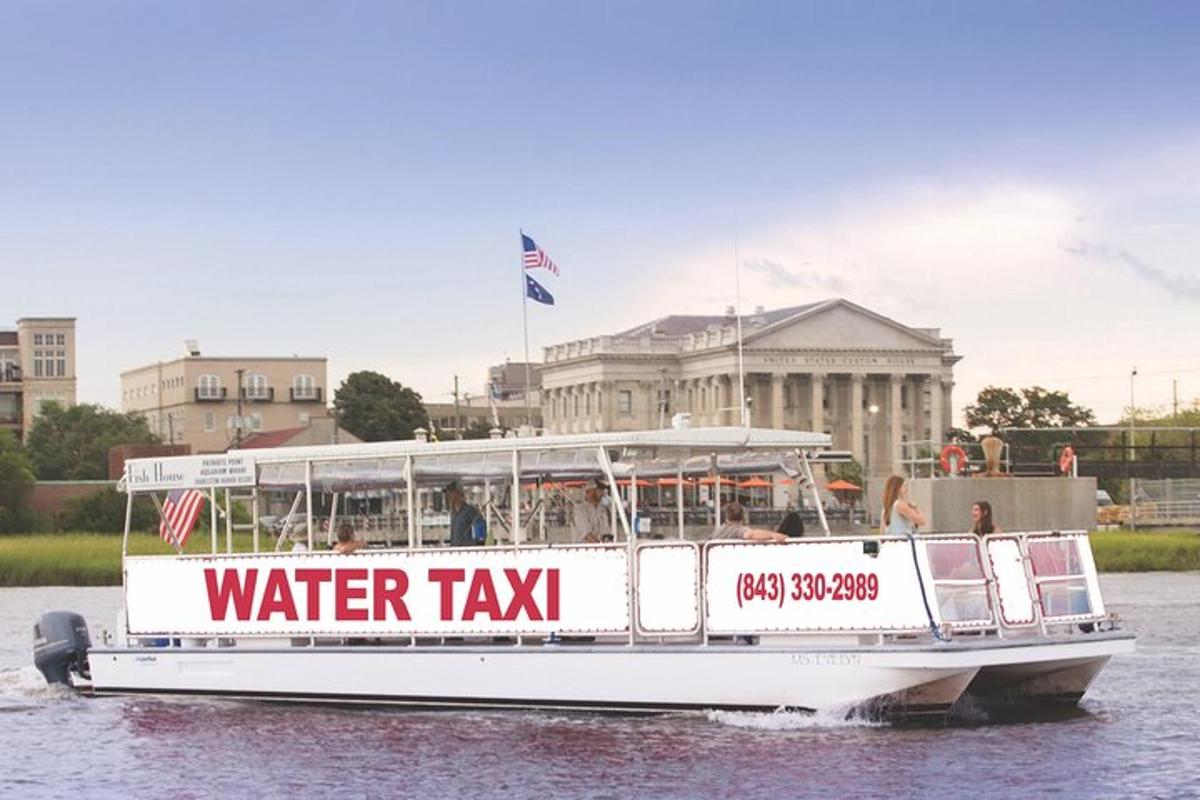 a water taxi boat on the water in front of a building