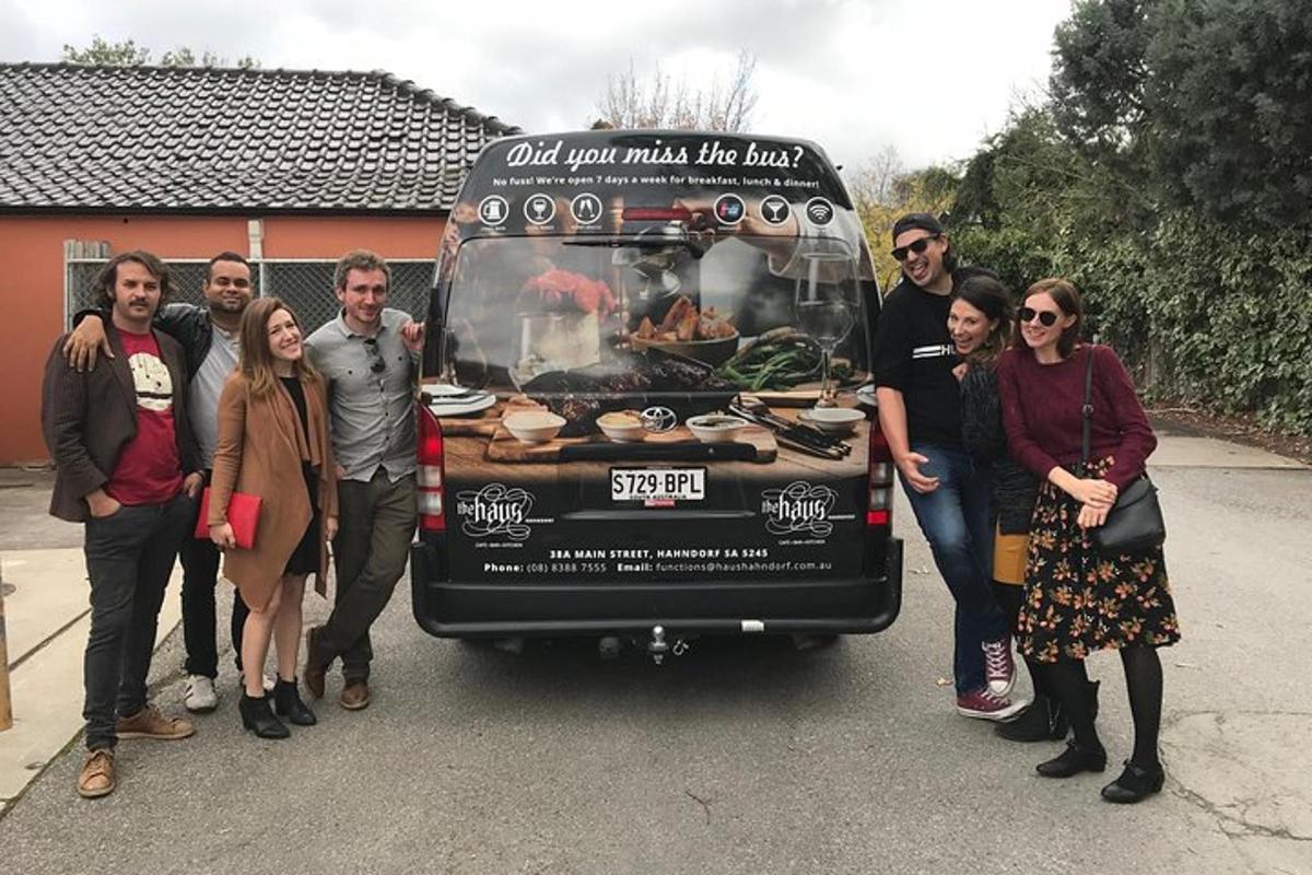 a group of people standing in front of a van