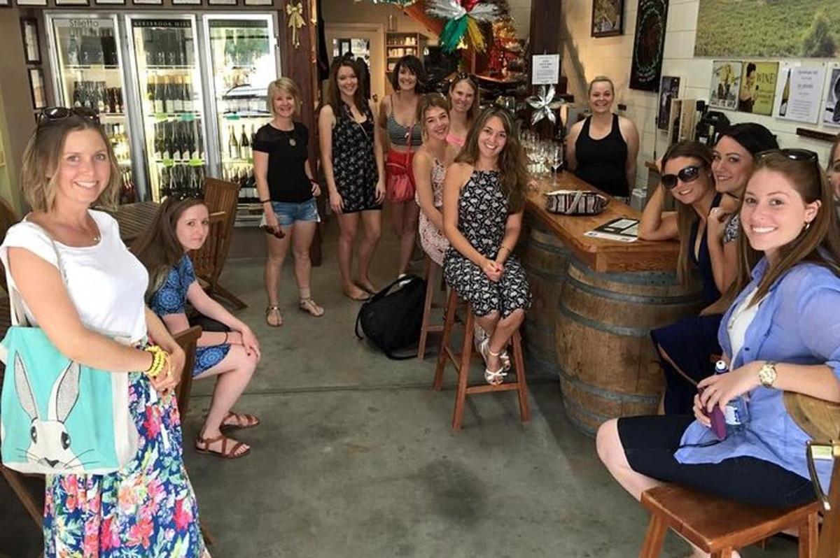 a group of women posing at a bar