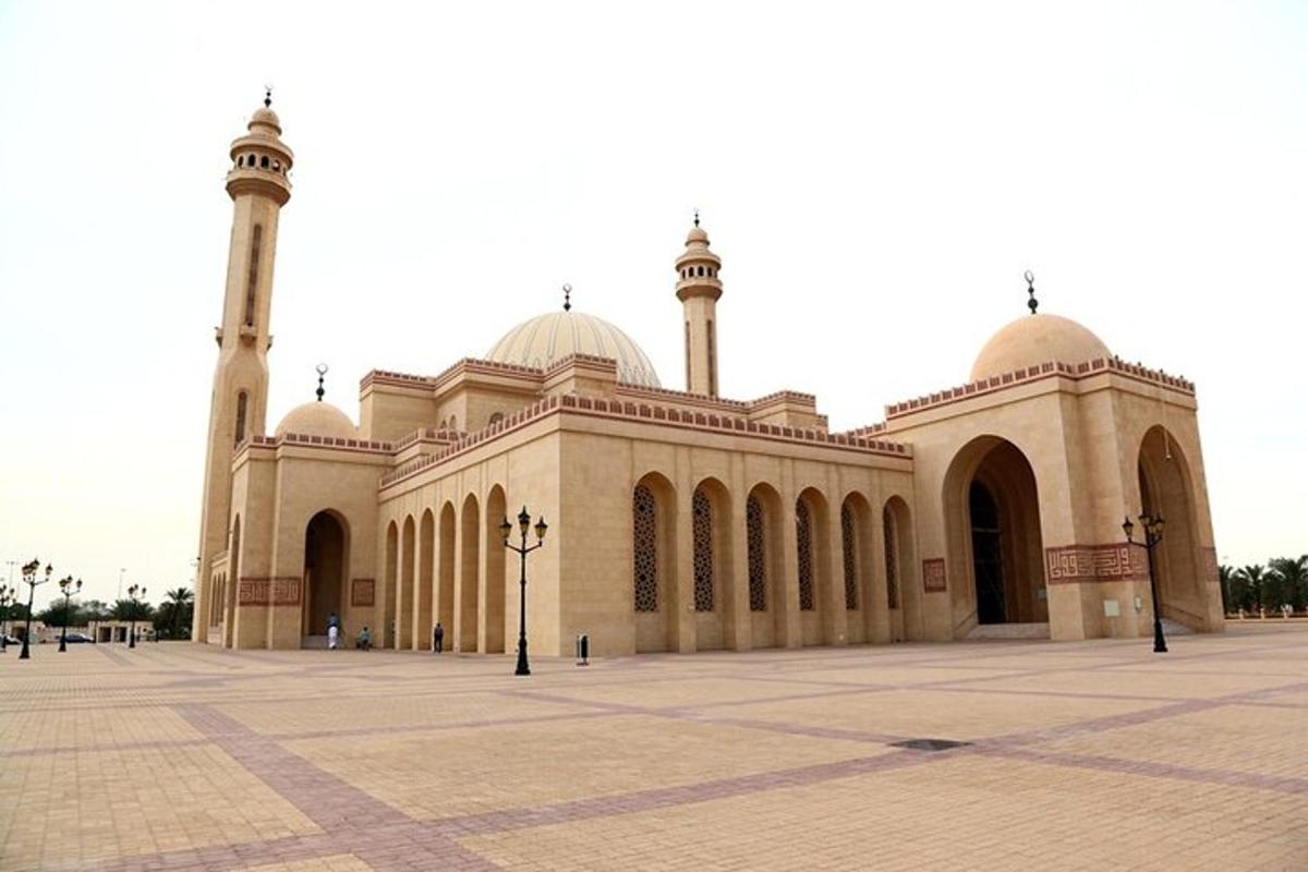 a large building with two domes and a mosque