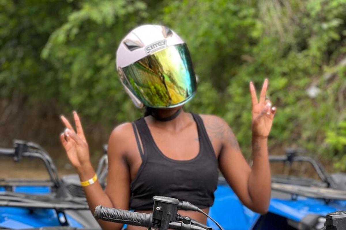 a woman riding a bike with a helmet on her head