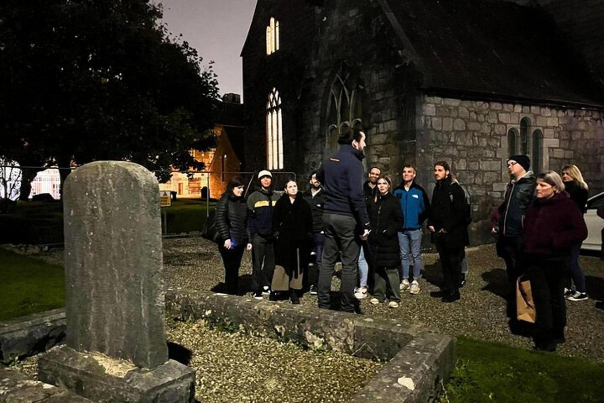 a group of people standing in front of a church