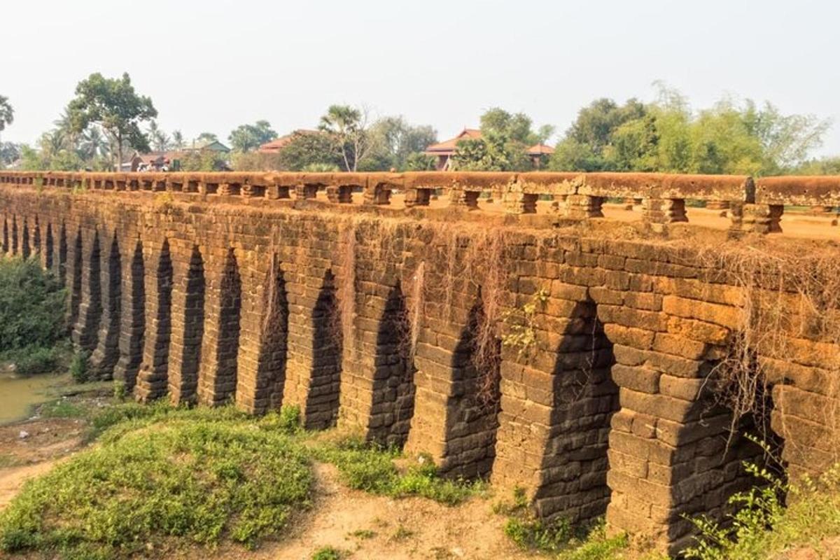 an old brick bridge over a river