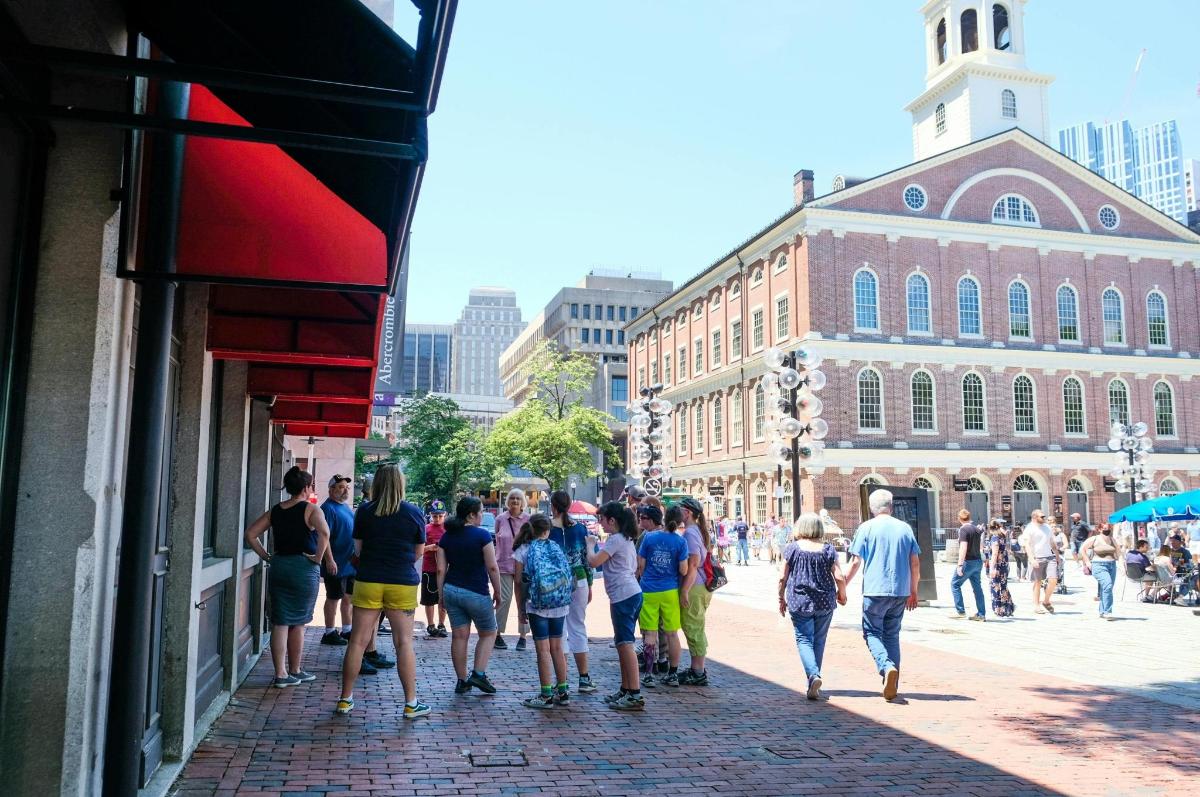 a group of people walking down a street