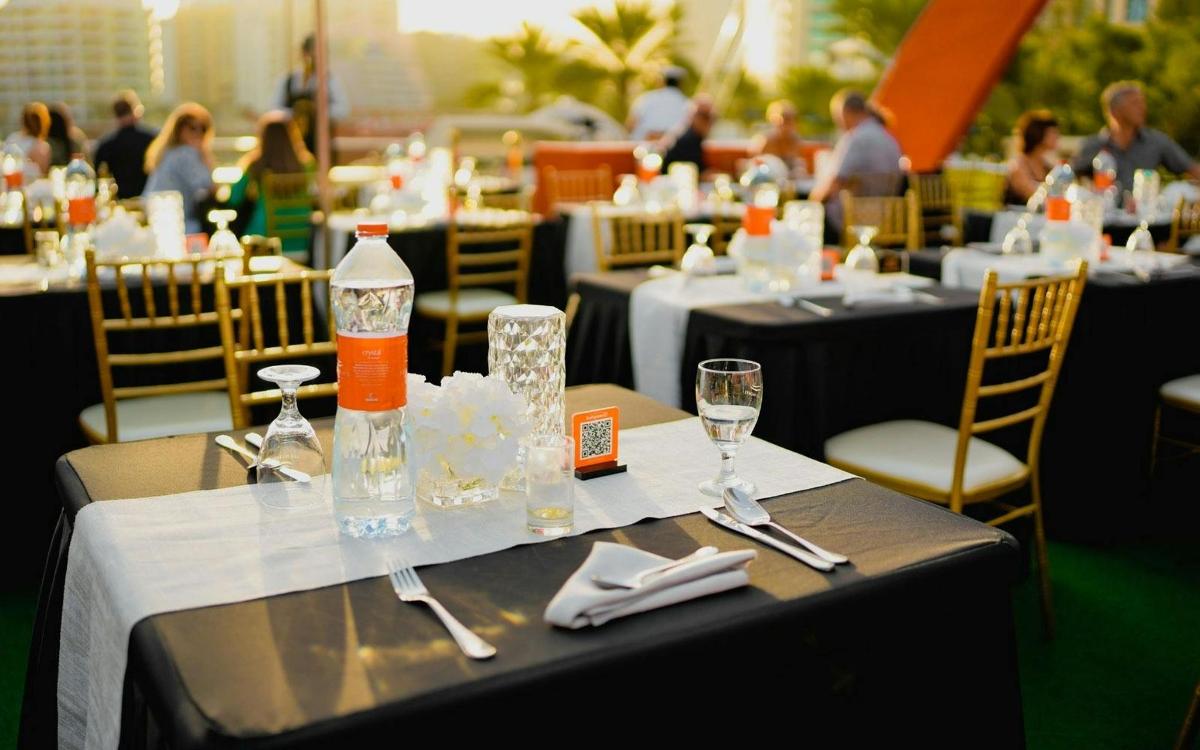 a table with glasses and bottles of water on it