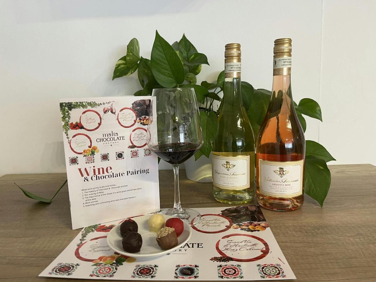 a table with two bottles and a glass of wine