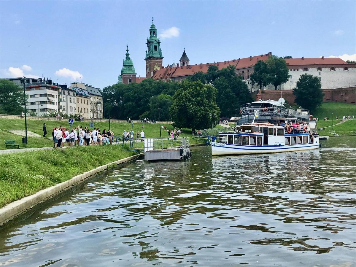 a boat traveling down a river in a city