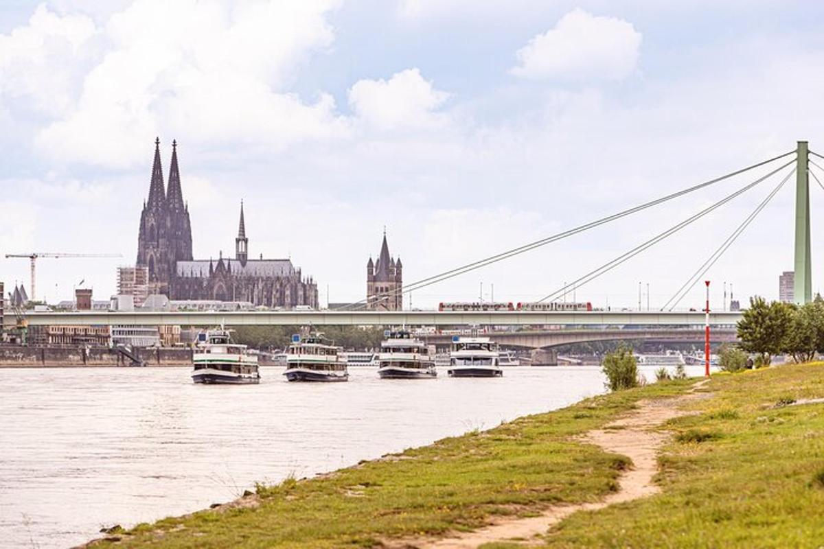a group of boats on a river with a bridge