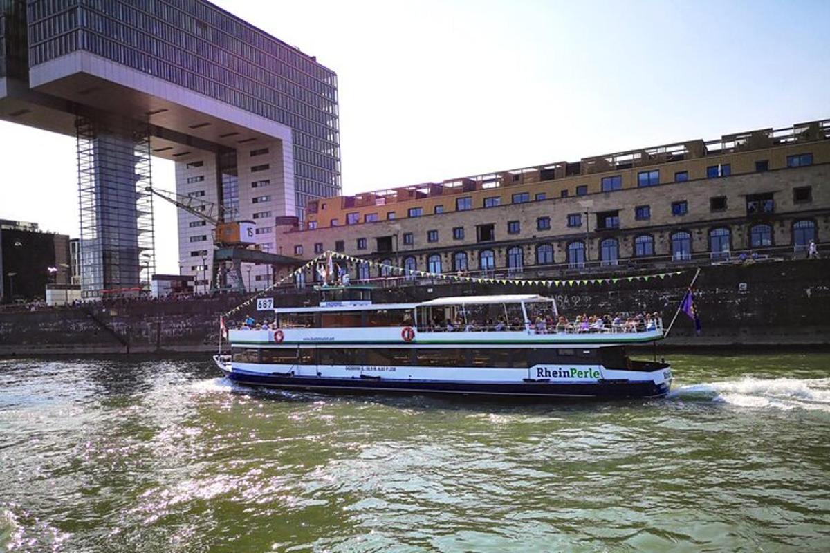a boat on the water in a river with buildings