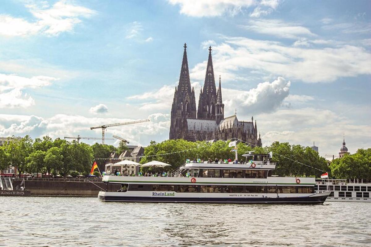 a boat on the water in front of a cathedral