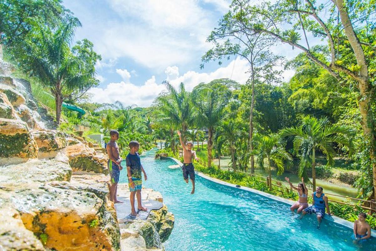 a group of people in a pool at a water park
