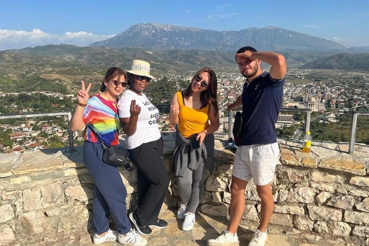 a group of people standing on top of a mountain