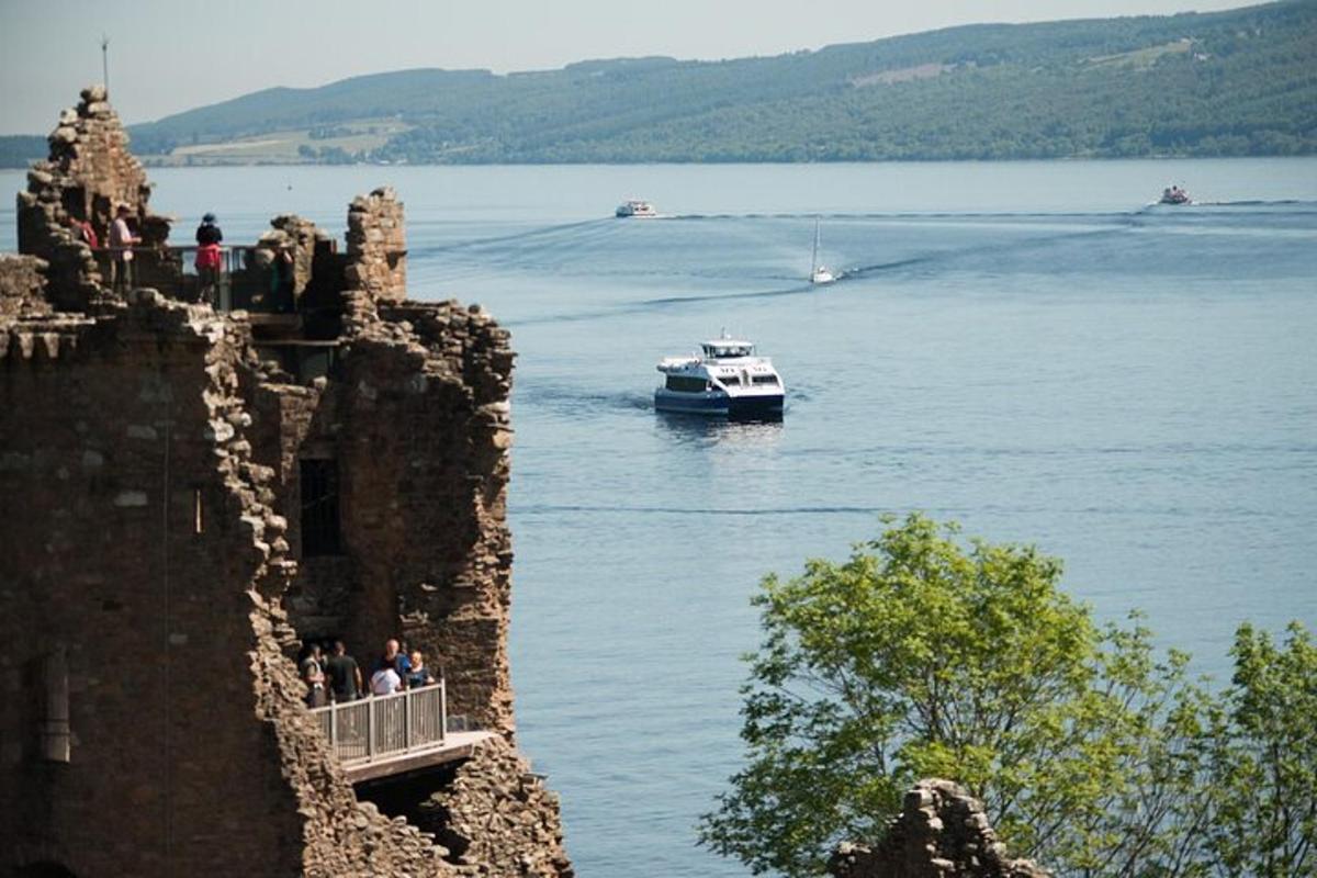 a boat in the water next to a castle